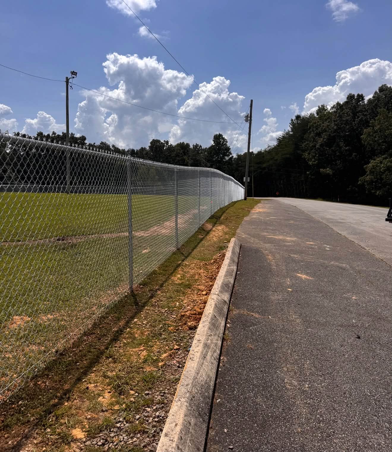 Chain-link fence built by Tennessee Fence Systems LLC along a road in Tennessee
